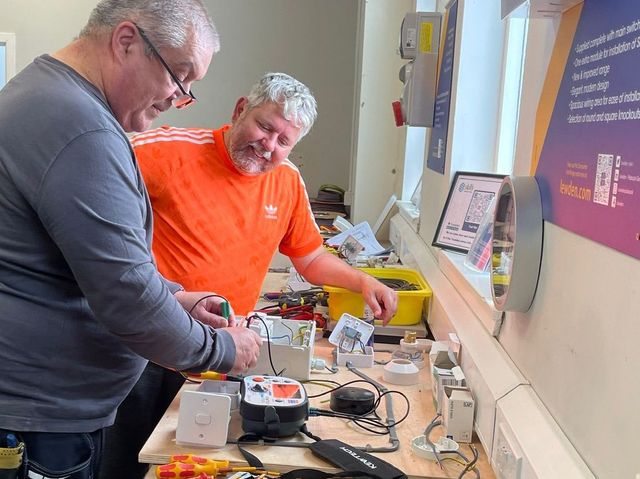 Learners testing electrical equipment